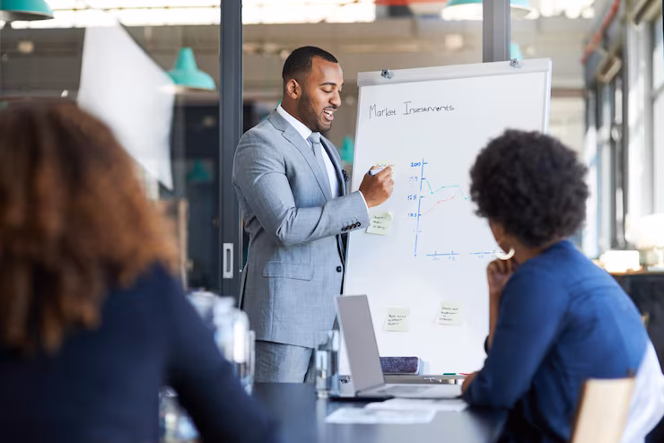 just like that we could triple our sales shot young businessman giving presentation his colleagues office 590464 27757